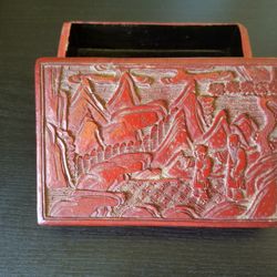A Chinese Cinabar Box Decorated With People Under the Pine Trees