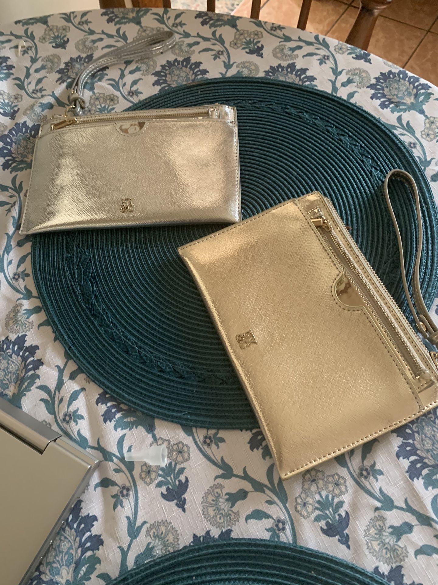 Two NY & CO Clutch Wristlets In Gold And Silver