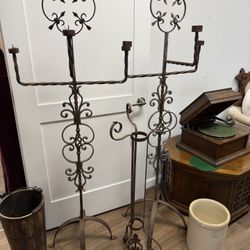 Pair of metal candle stands. 65”h, 21”w