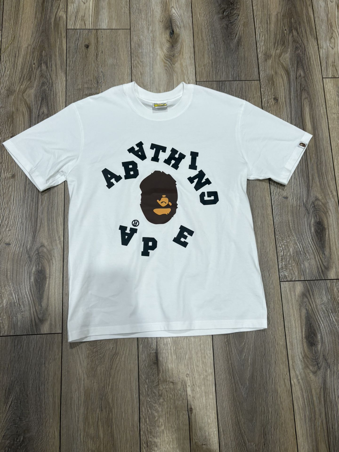 White BAPE t-shirt with black logo and graphic #streetwear