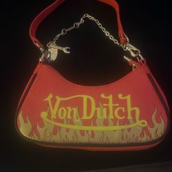 NWT Von Dutch Red and Yellow Flames Shoulder Bag  Th coolest bag ever! Made from vegan leather with faux leather handle, features a bold red exterior 