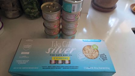 21 cans of Tiki silver cat food