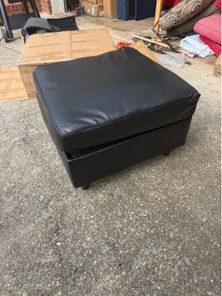 Faux leather ottoman with storage