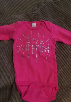 I’m a surprise 0-3 month onesie. Super cute!