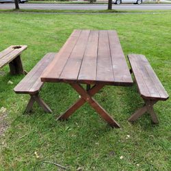 Rustic picnic table with unattached benches