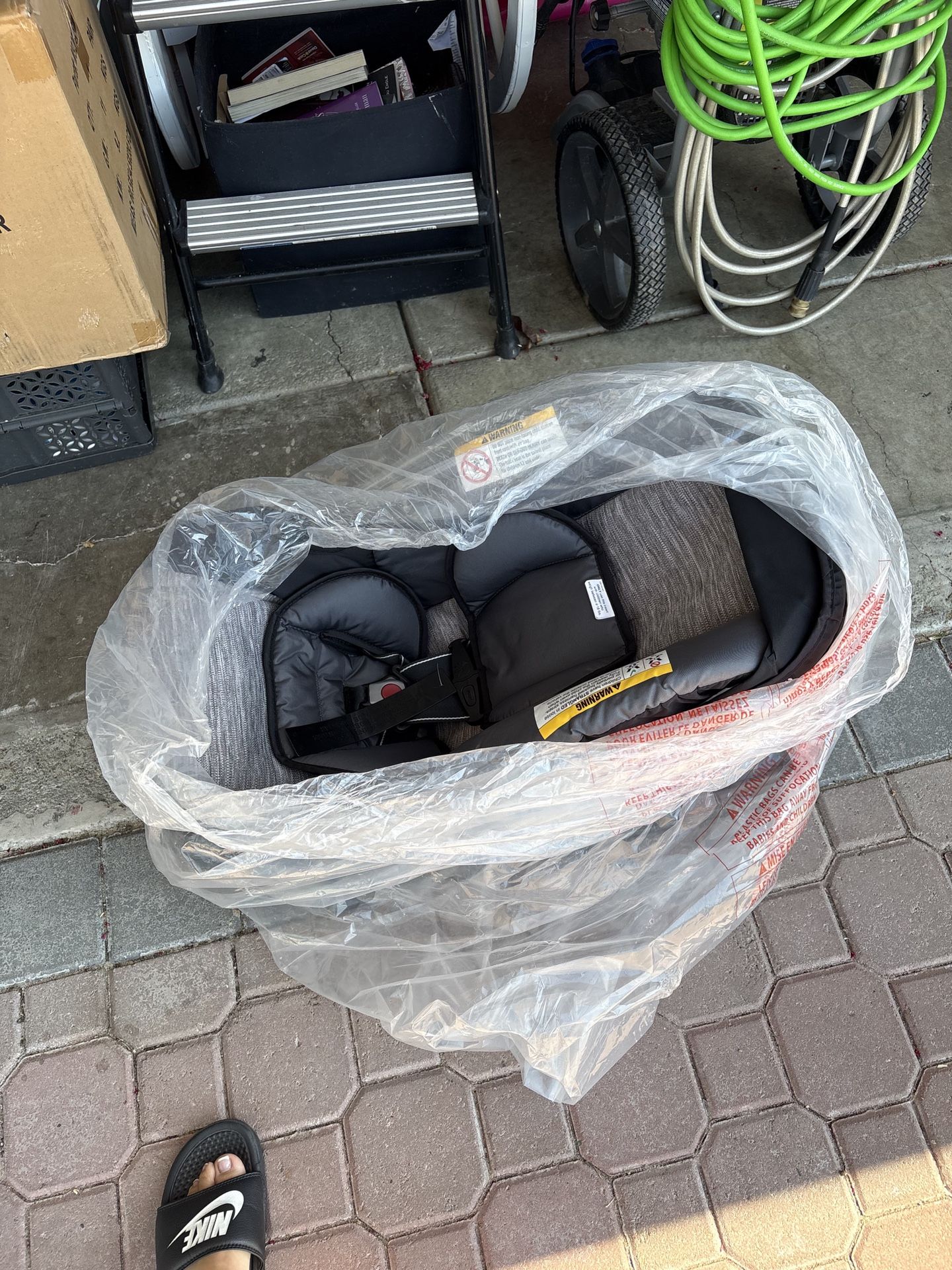 Brand new car seat with bass, black and gray