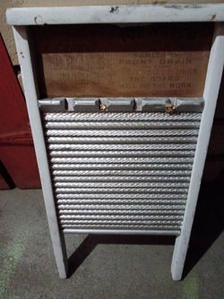 Antique wooden and brass washing board.