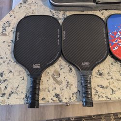 4 pickle ball rackets (2 never used), 6 balls,  2 cases