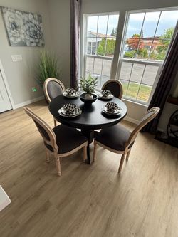 Dining room table 4 chairs plates, etc.