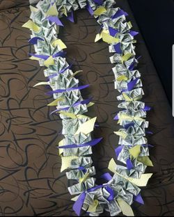 Money lei with ribbon accents for graduation or any occasion