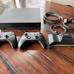Xbox One X + 2 controllers + Charger (no battery)