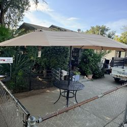 Three Piece Umbrella, One Table 4 Chairs
