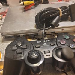 PLAYSTATION  2 SLIM  WITH  ONE  CONTROLLER  AND MEMORY CARD 