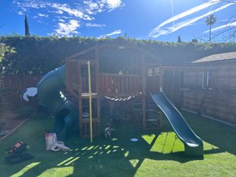 Kids playhouse with swings and slides