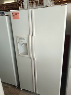 GE Side by Side Refrigerator White ex large excellent . Warranty . Delivery available . 2203 Fowler st. Ft. Myers 33901