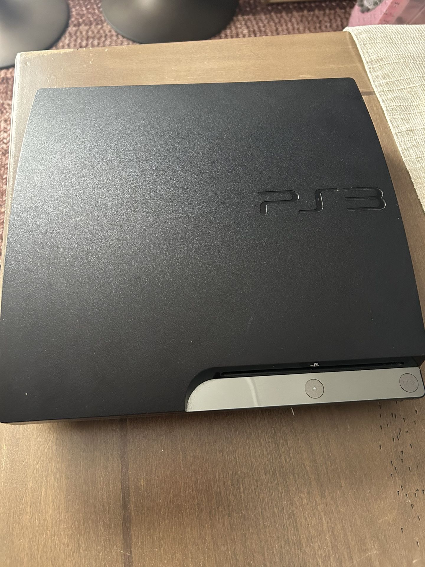 PS3 with controllers and games