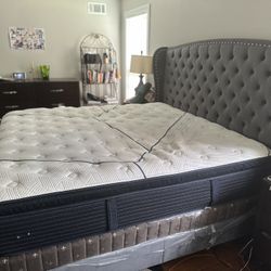 Eastern king bed with mattress and box spring.