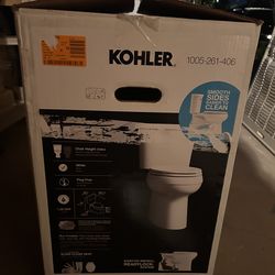 New Kohler Elongated Chair Height Toilet in White with Soft Close Seat