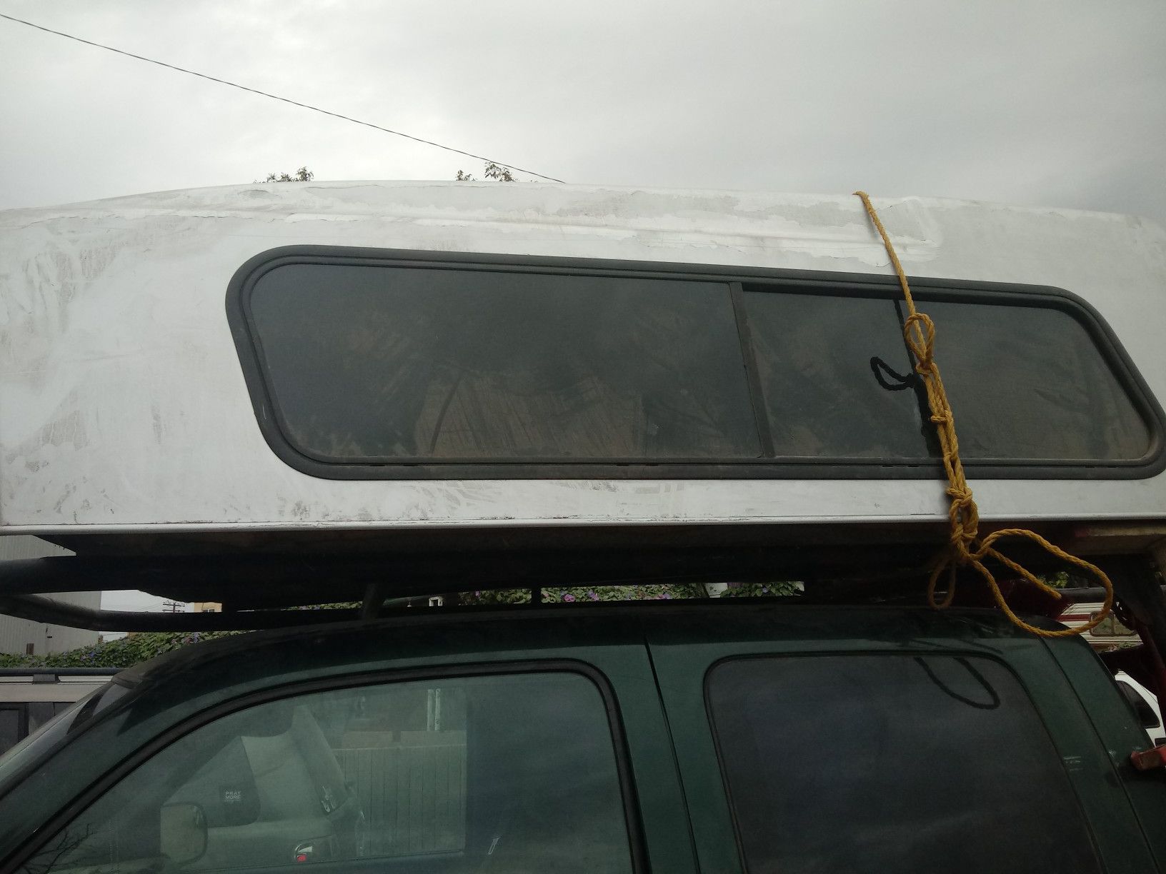 Designer camper shell fits midsize truck