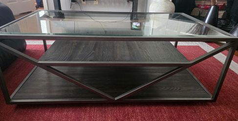 Glass top coffee table on rollers
