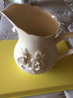 Creamy white pitcher/vase with raised flowers