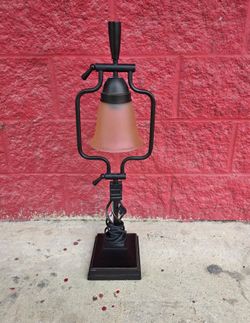Excellent quality industrial table lamp with frosted glass shade, hinged arm so that the lamp can pivot slightly, oiled rubbed bronze finish