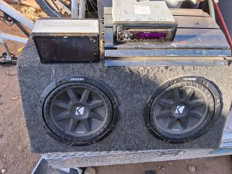 2 Kicker Subs with sturdy felt lined box.