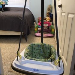 Baby bouncer, hangs from door frame
