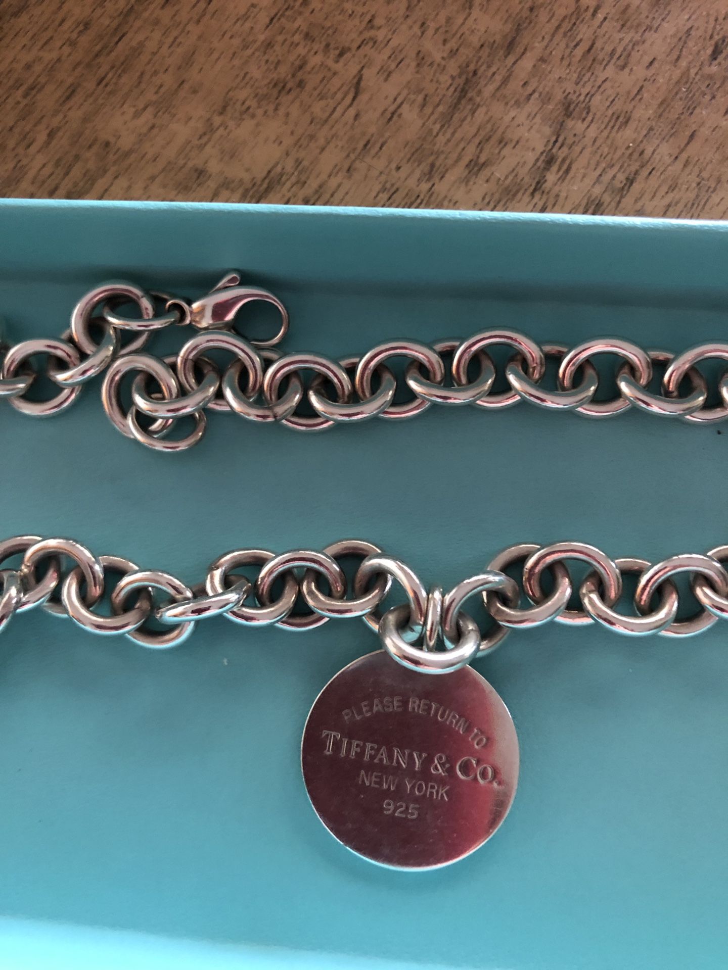 Tiffany &CO necklace with round charm, return to Tiffany.