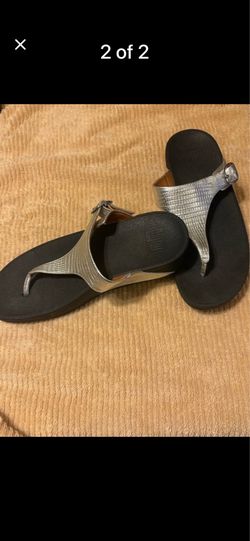 Women’s silver Fit Flop brand sandals