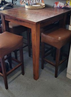 42"  bar table with four chairs.