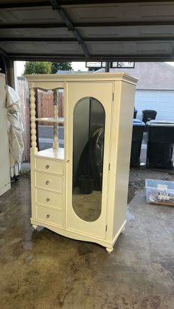 Armoire closet with drawers