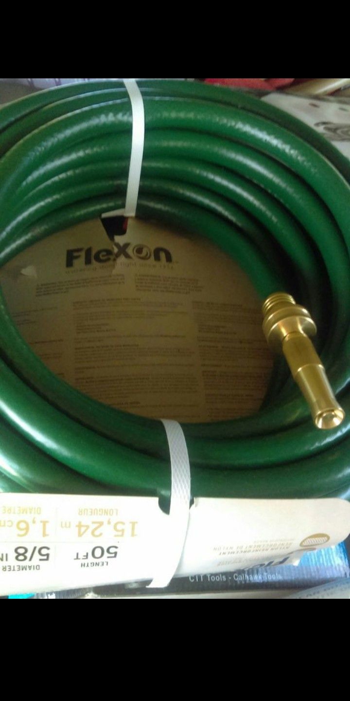 50ft. Garden hose new with nozzle $15.00 firm