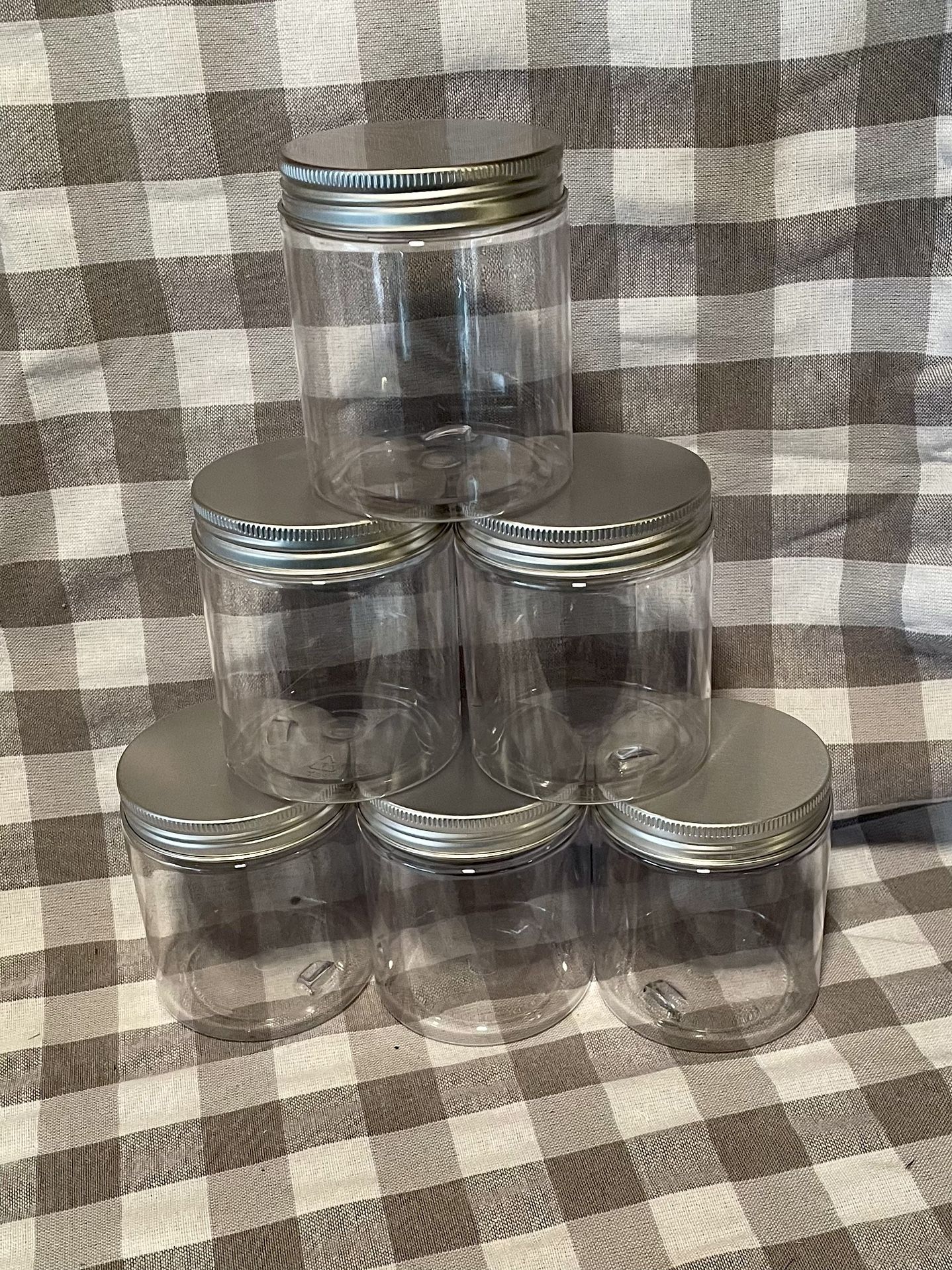 Six plastic screw top Containers