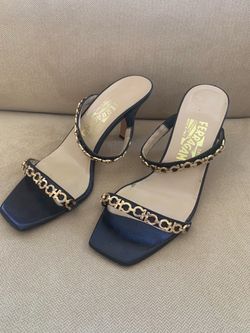 Ferragamo  Woman’s shoes In Black with gold chain. In perfect condition. Paid $ 895  size 9