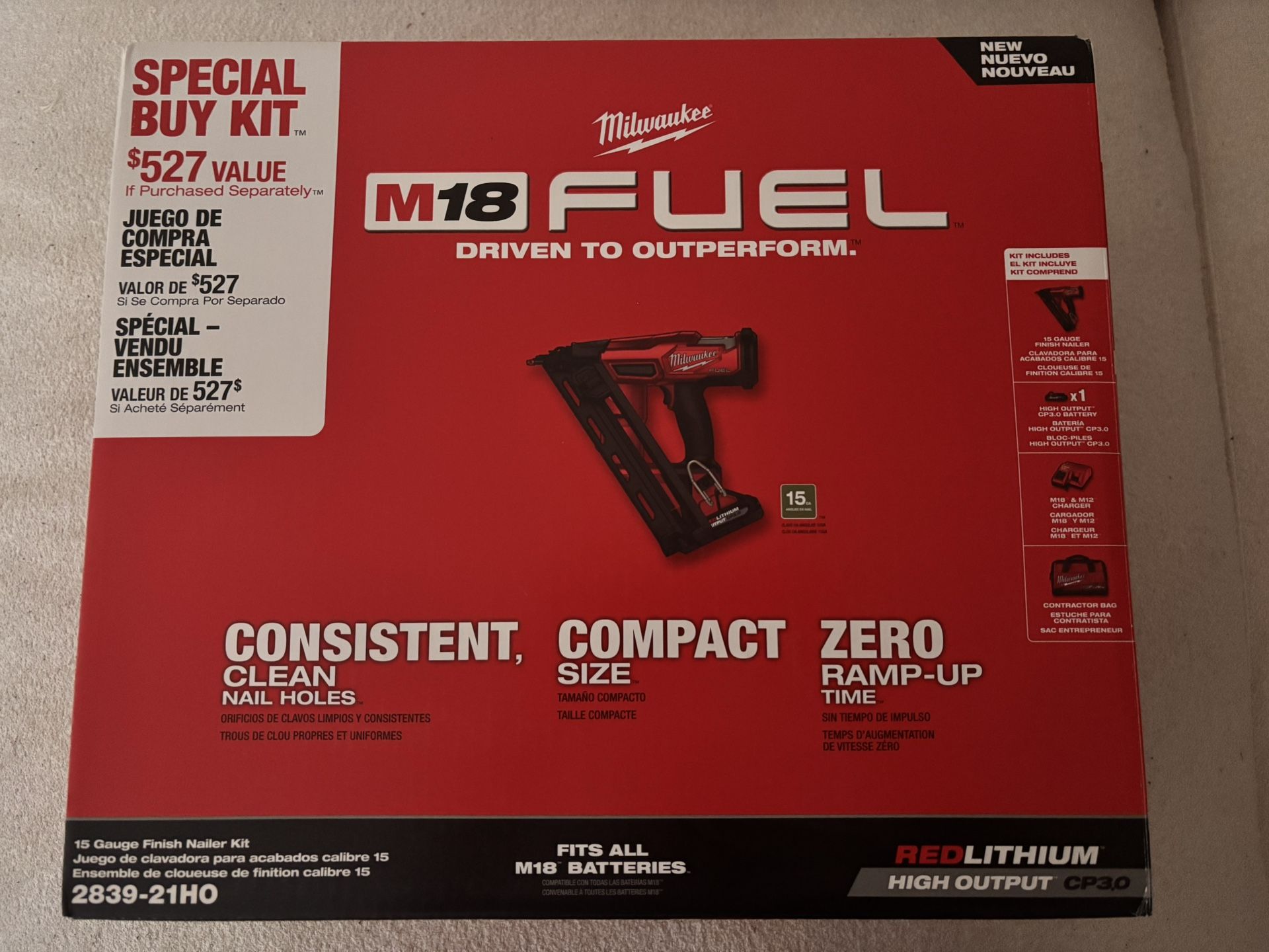 Milwaukee M18 FUEL 15G angle finish nail gun with a battery and charger