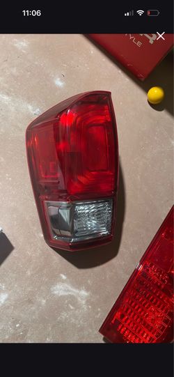 Rear Tail Light Assembly for a Toyota Tacoma, specifically matching models from 2016 to 2019.