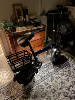 Black Electric Scooter with Seat and Basket