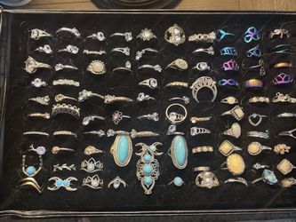 Diverse collection of rings in various styles including bohemian, classic, and modern designs. The set features a wide range of materials such as silv
