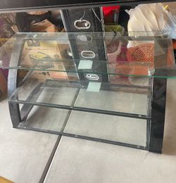 Used glass tv stand
