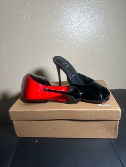 Black and red bottomed woman’s heels
