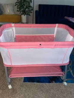 Baby Beside Bassinet