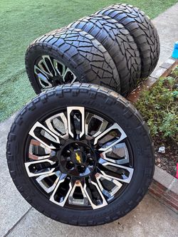 New ultimate edition wheels +. 33x12.50/22 tires (2) different brand