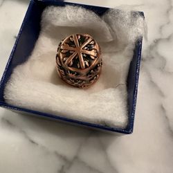 "Copper Antique" bead or thimble with a snowflake design. And Leaves/acorns