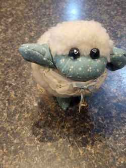 Plush round lamb iwth bell at neck and lace collar, blue country nose and ears approx 6"