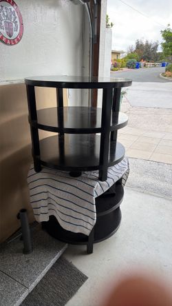 Two round black end tables for sale