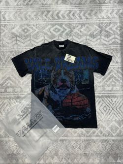 Vale Dreams T-Shirt with graphic of a dog holding a basketball