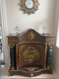 Antique Ornate Wood Cabinet with Gold Accents and Storage