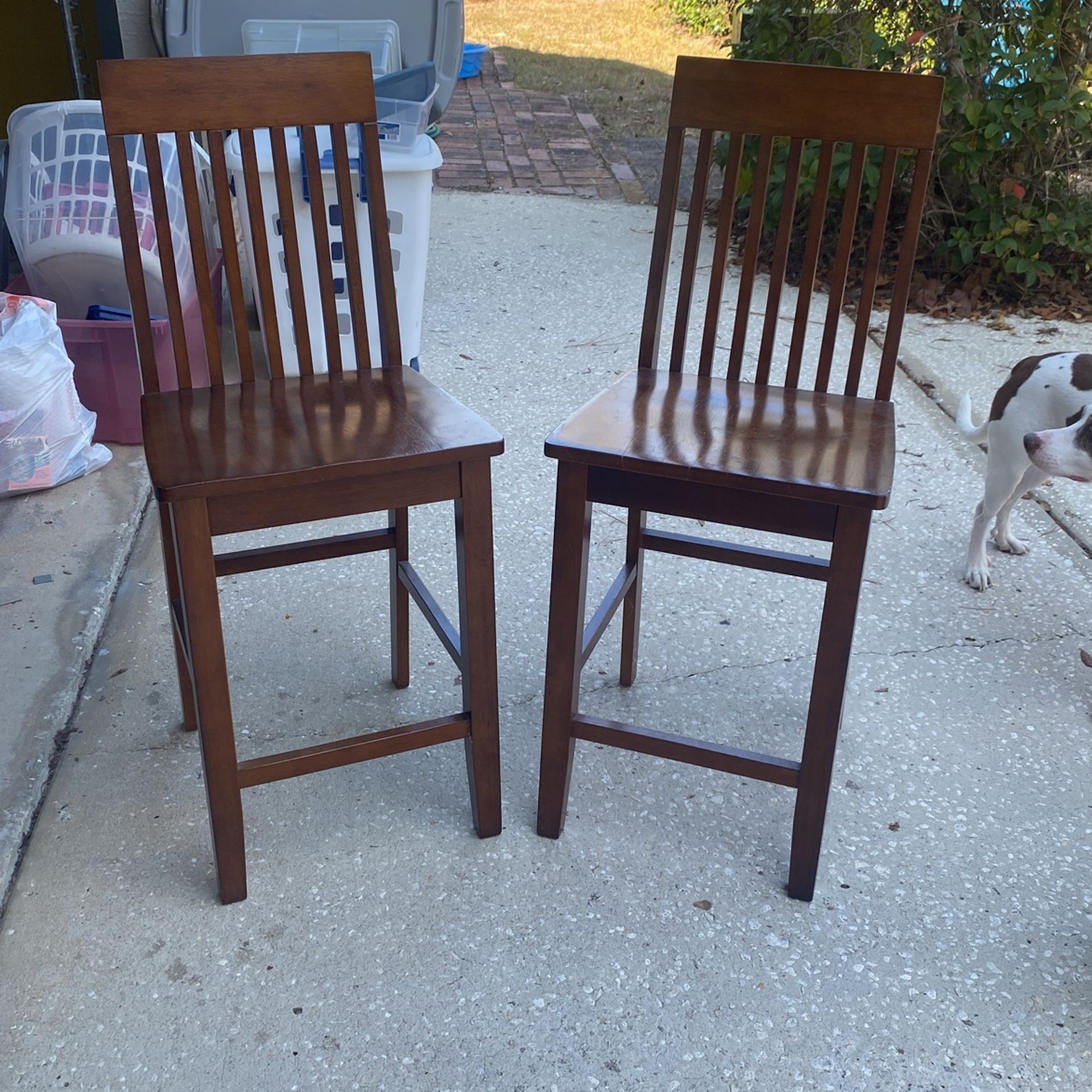 set of 2 brown wooden high-top bar chairs