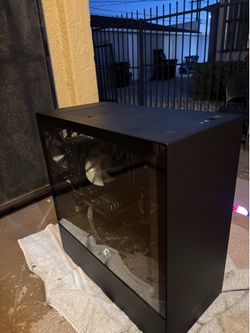 Black NZXT pc with a black keyboard & mouse